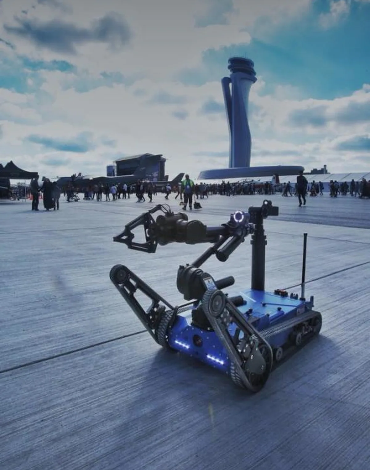 Unmanned ground vehicle carrying a light stabilised payload