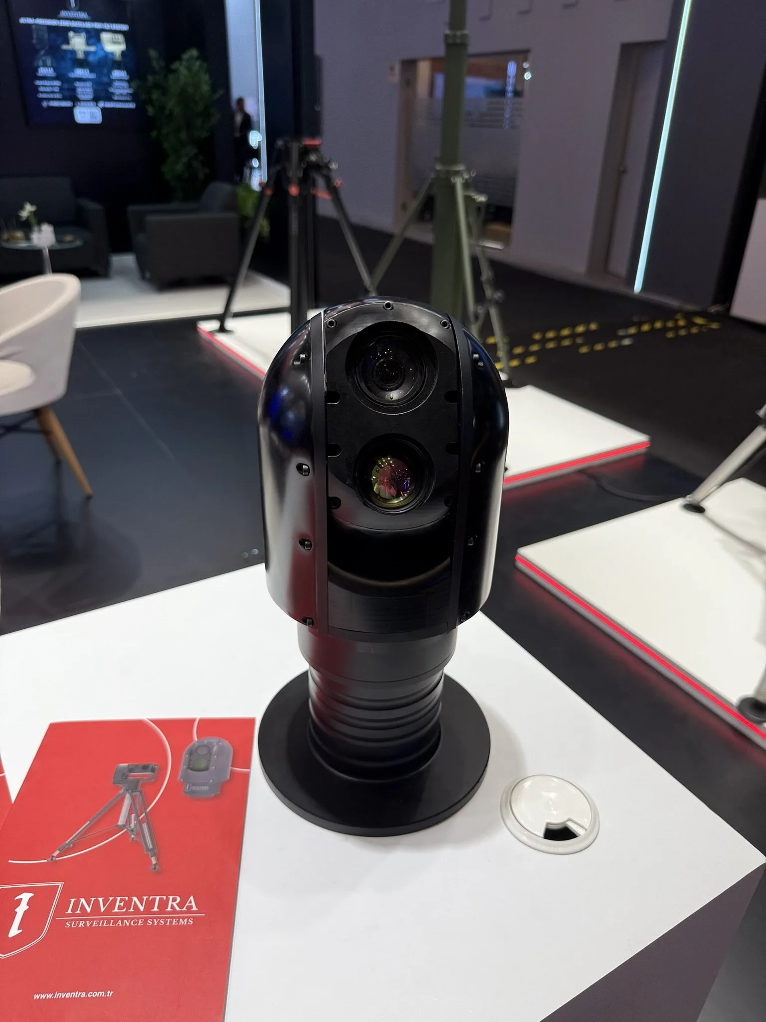 Dome-type gimbal on the counter beside an Inventra brochure.