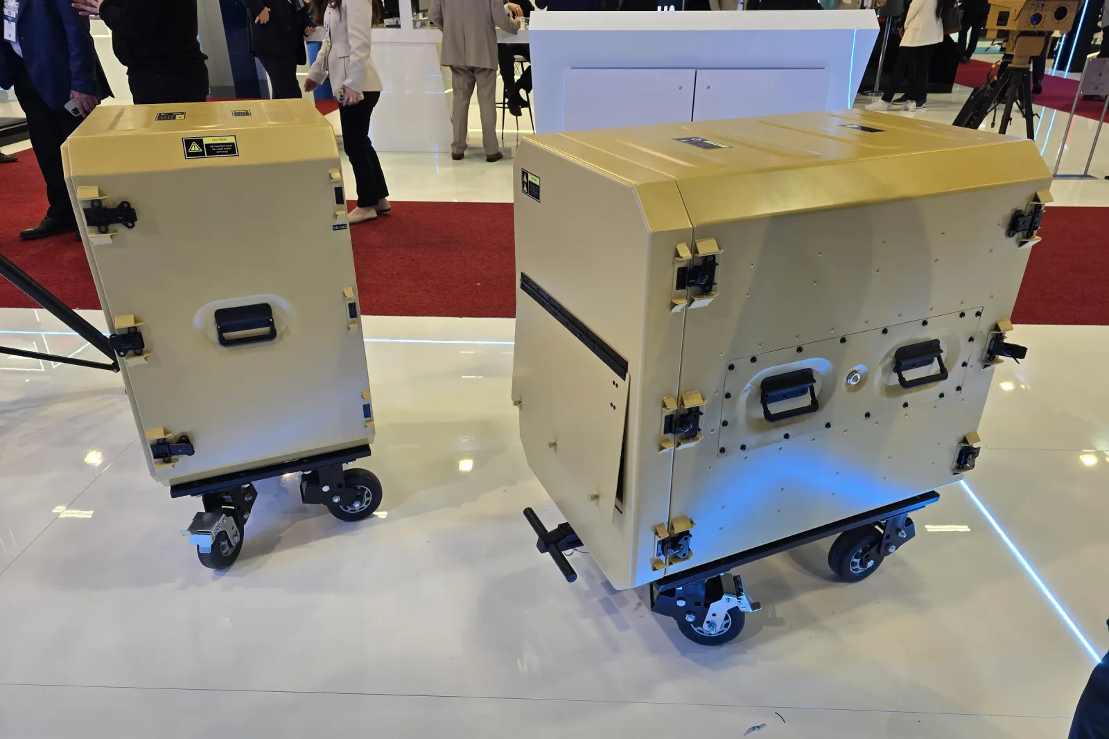 Two rack cabins on the stand, the nearer one with a side panel removed.