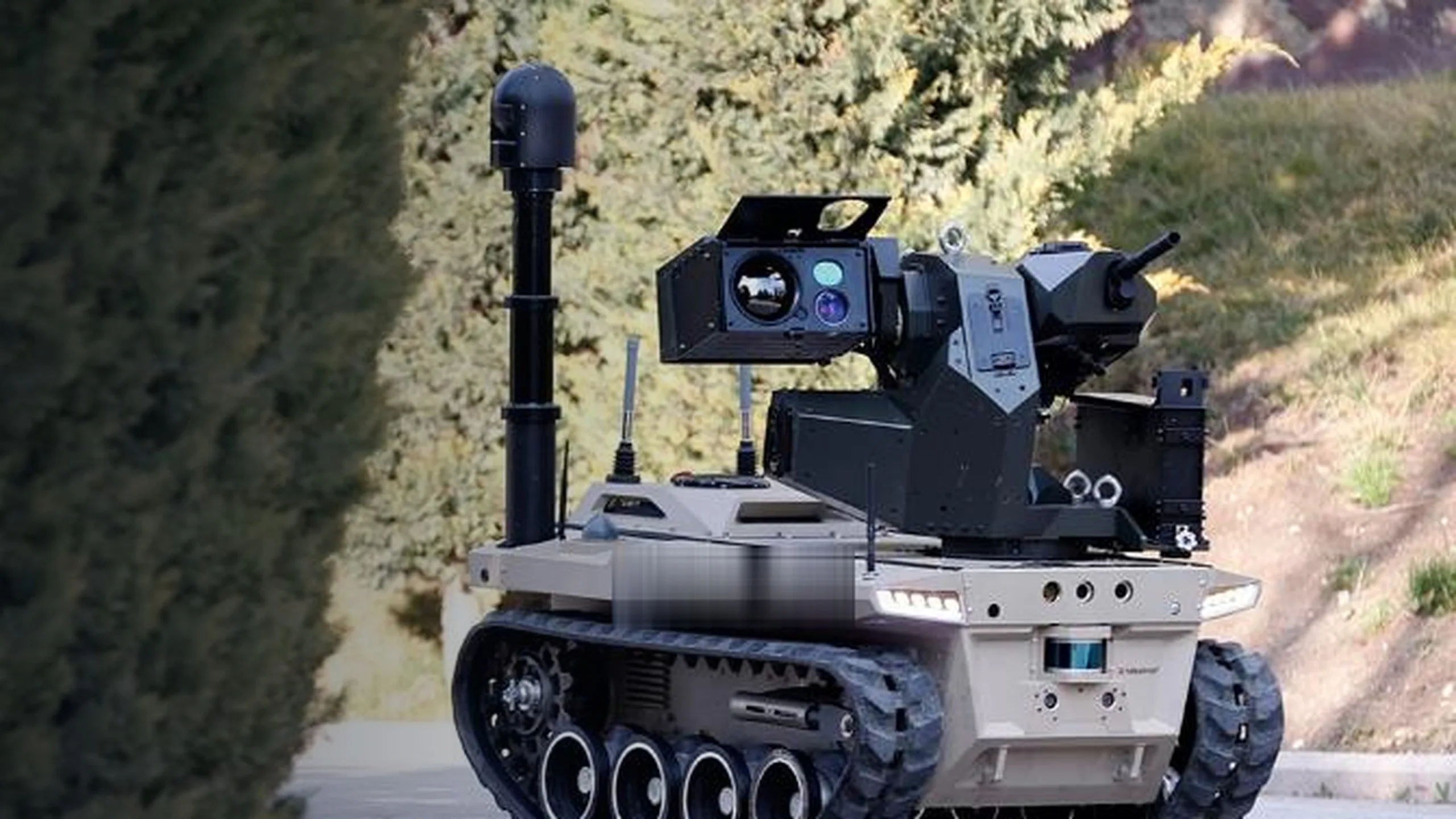 Pan-tilt unit carrying a sensor payload on a tracked vehicle