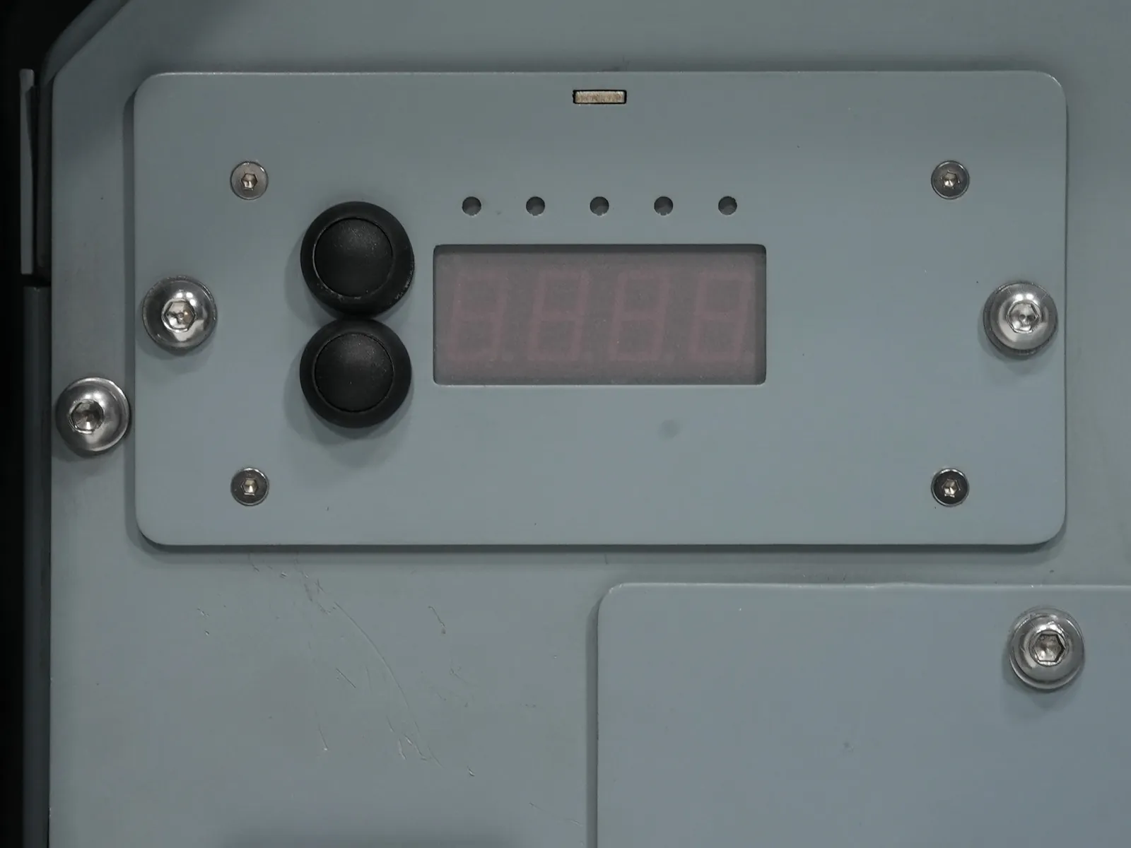 Close view of the front panel digital display and main switch