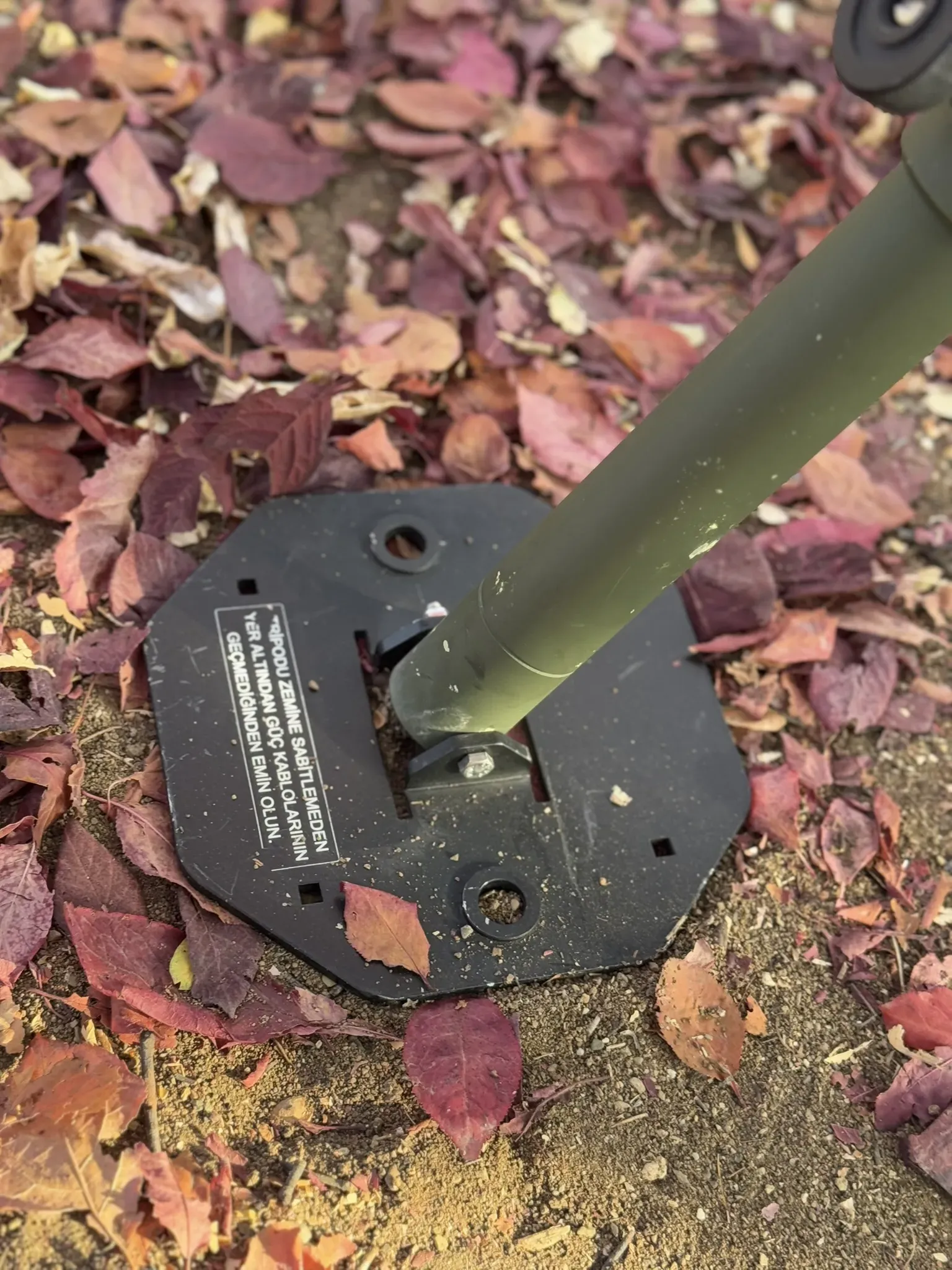 A foot plate bedded into the soil