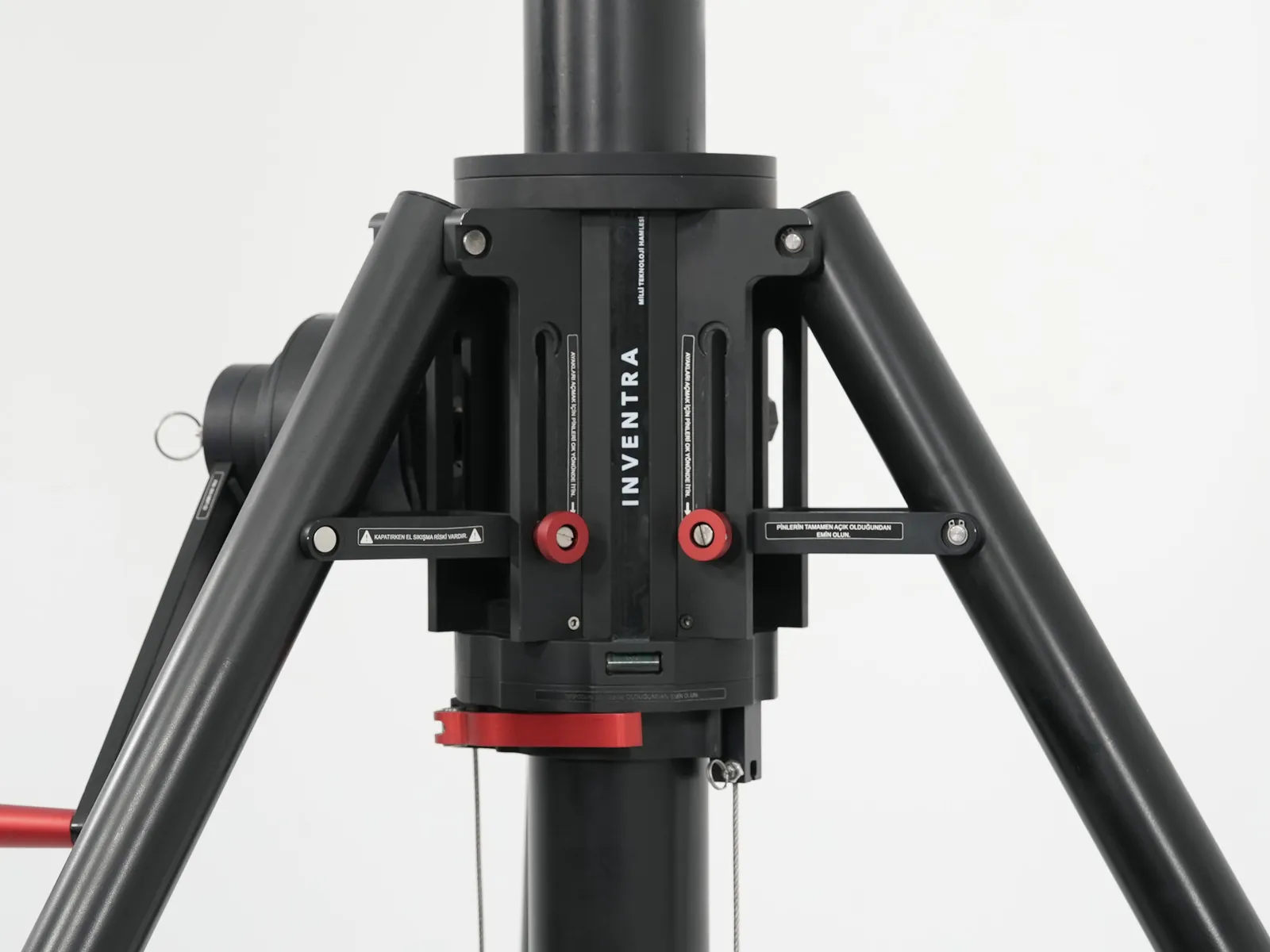 Locking clamp with the red locking buttons and warning labels