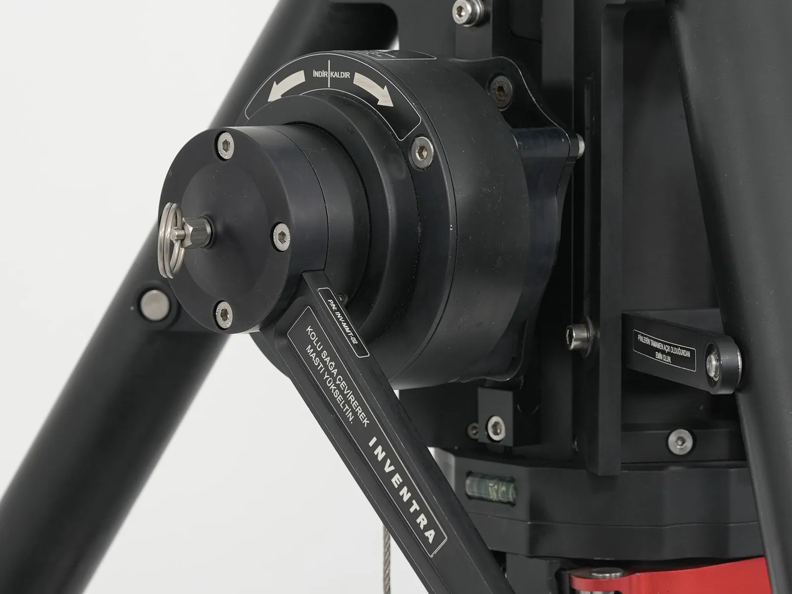 Winch mechanism from the side with the red handle visible