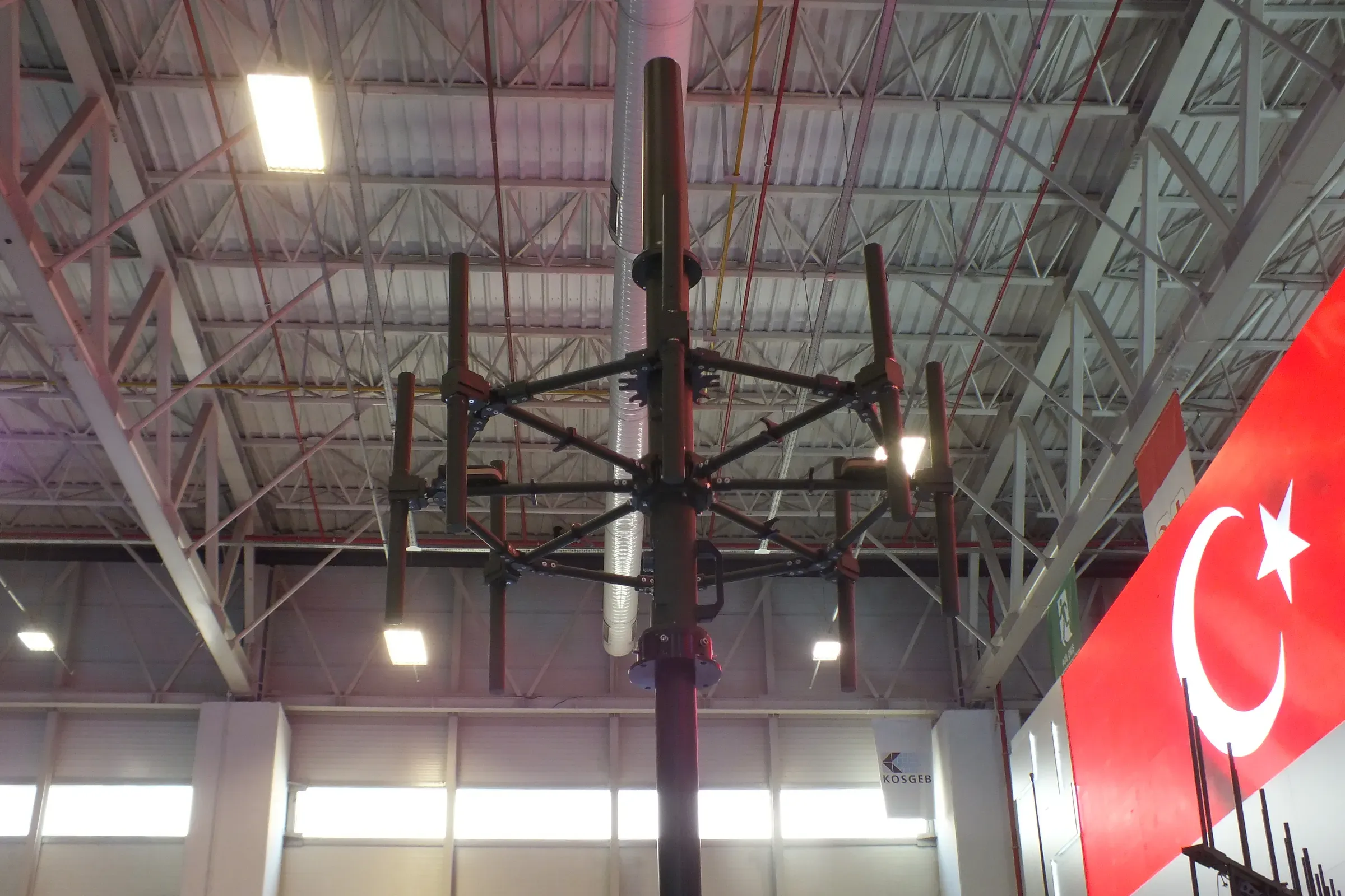 The radial antenna arms under the hall roof