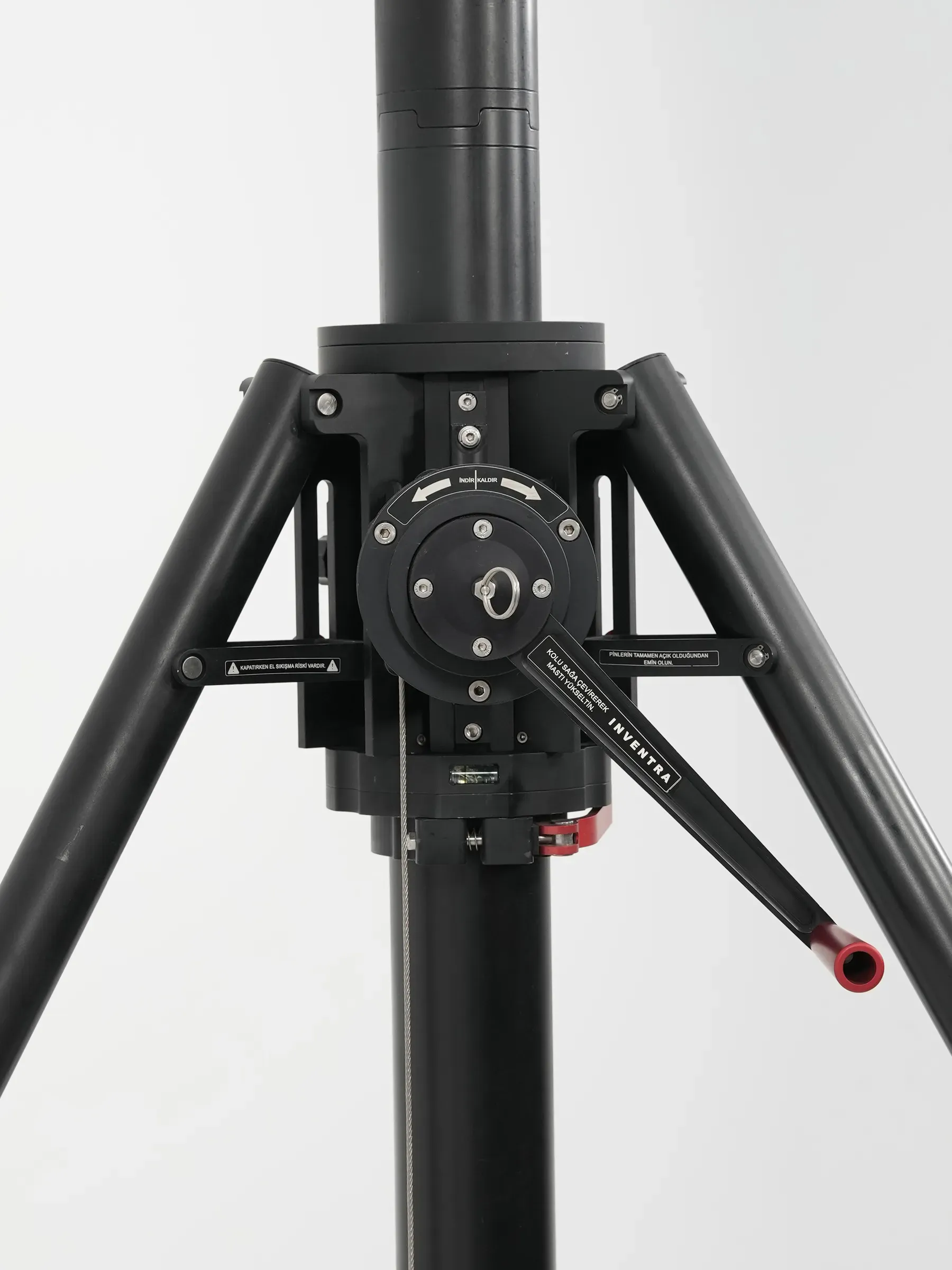 The crank handle reaching out from the head