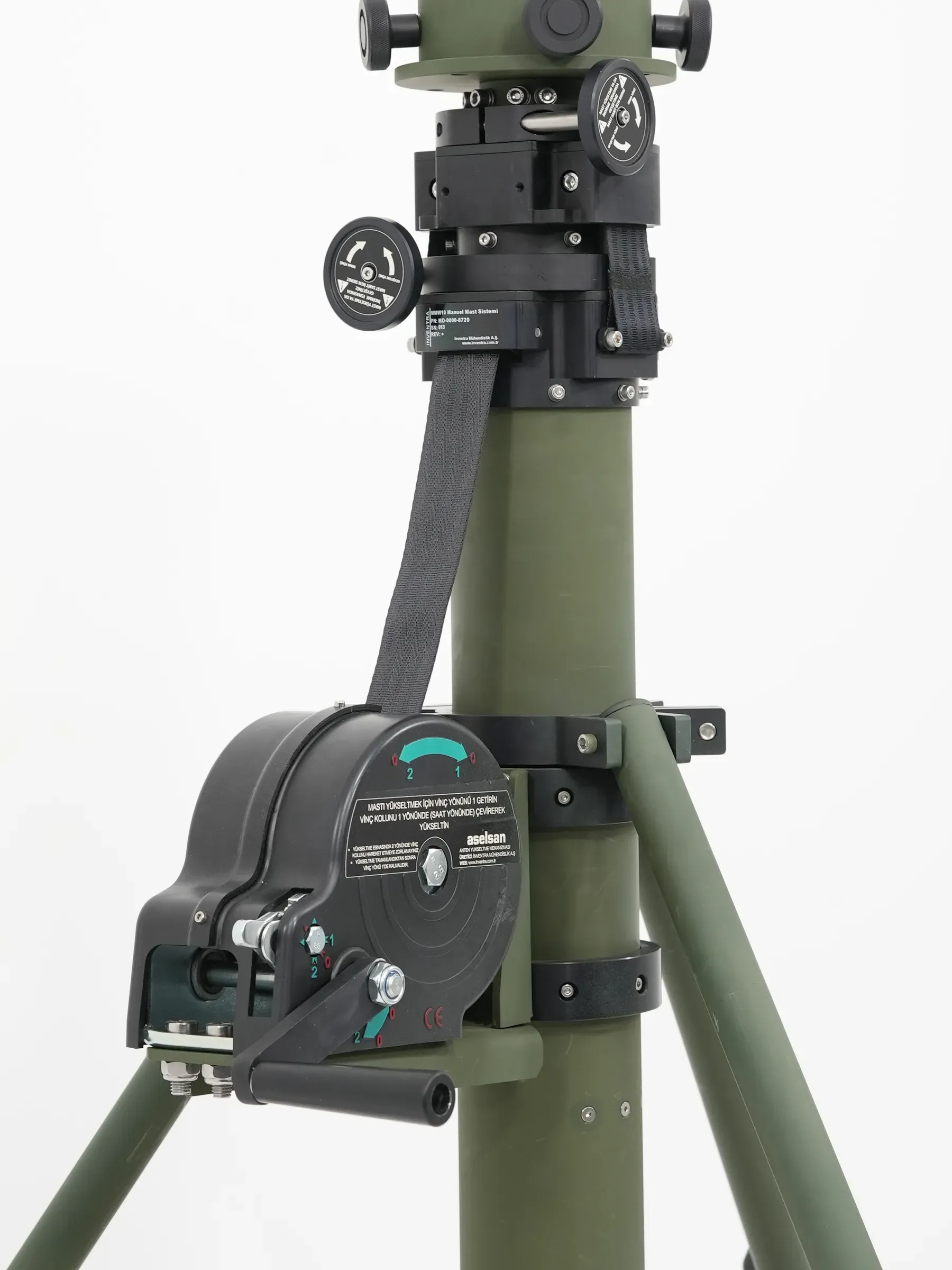 Upper mast showing head assembly, lifting strap and black winch drum with crank spindle.