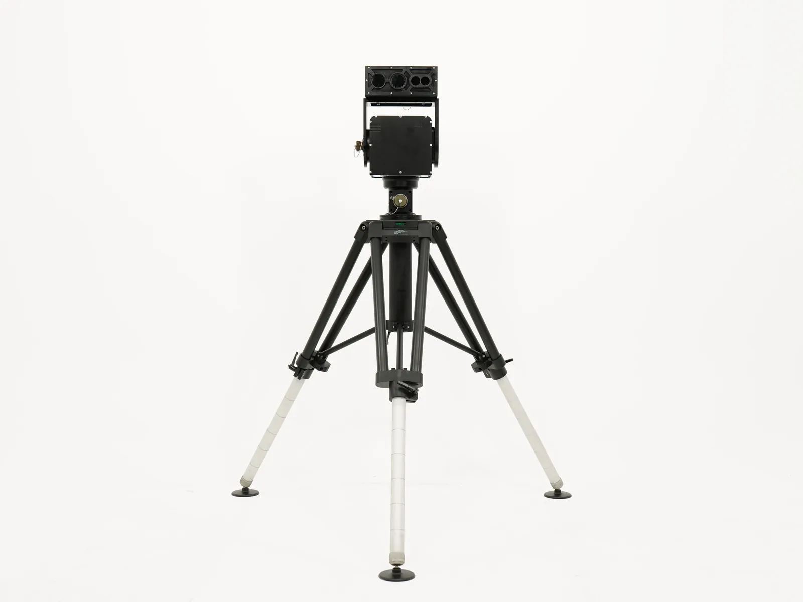 Ultra precision pan-tilt carrying a payload on a tripod, on a plain studio background
