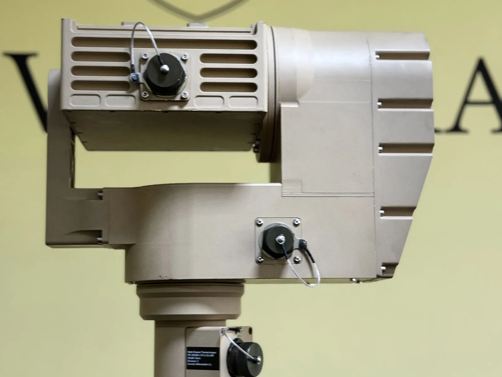 Body on a plain single-tone studio background: U-arm, azimuth housing, base plate and connectors