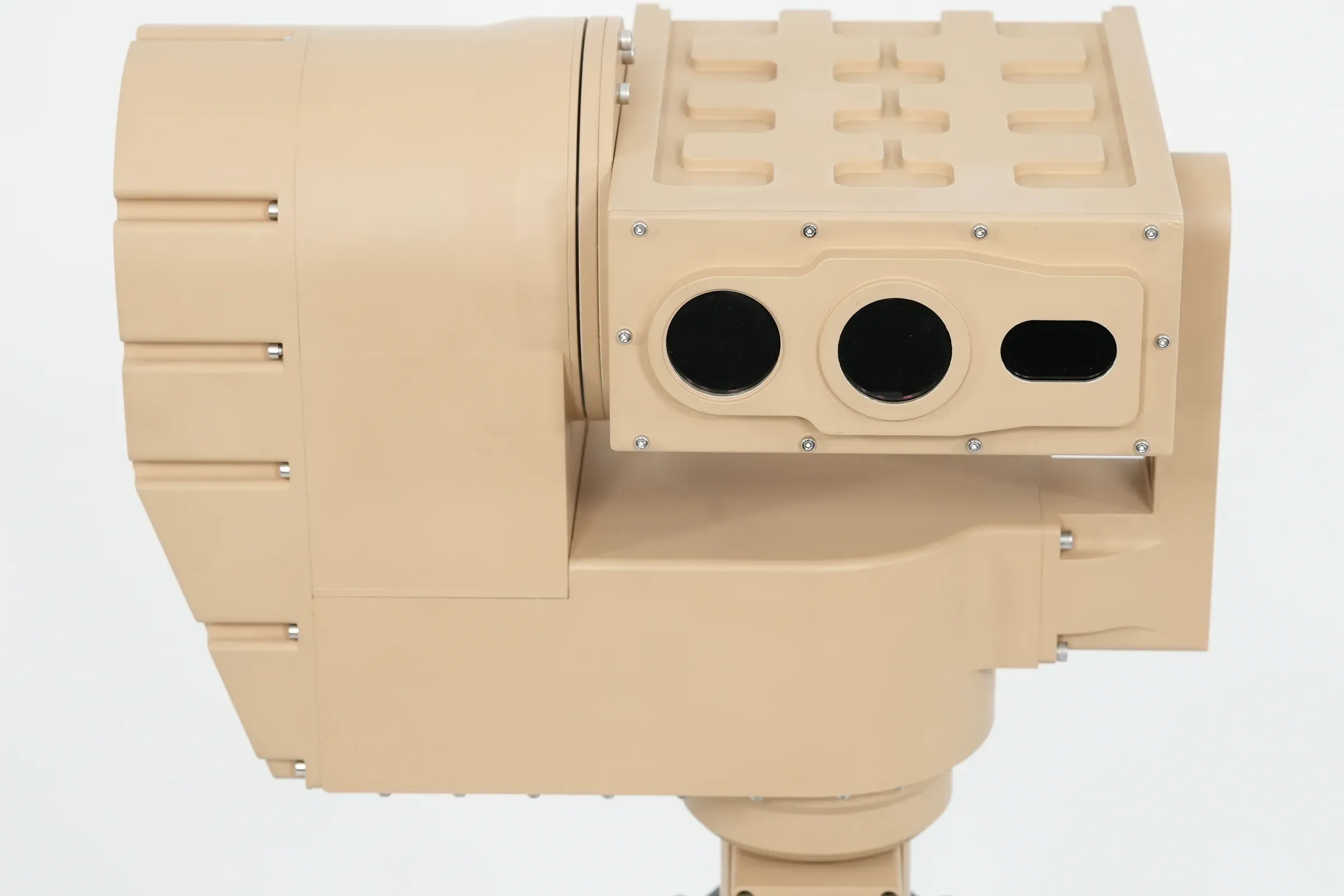Side view of the tan PED12 head with the ribbed sensor housing and three optical windows facing right.
