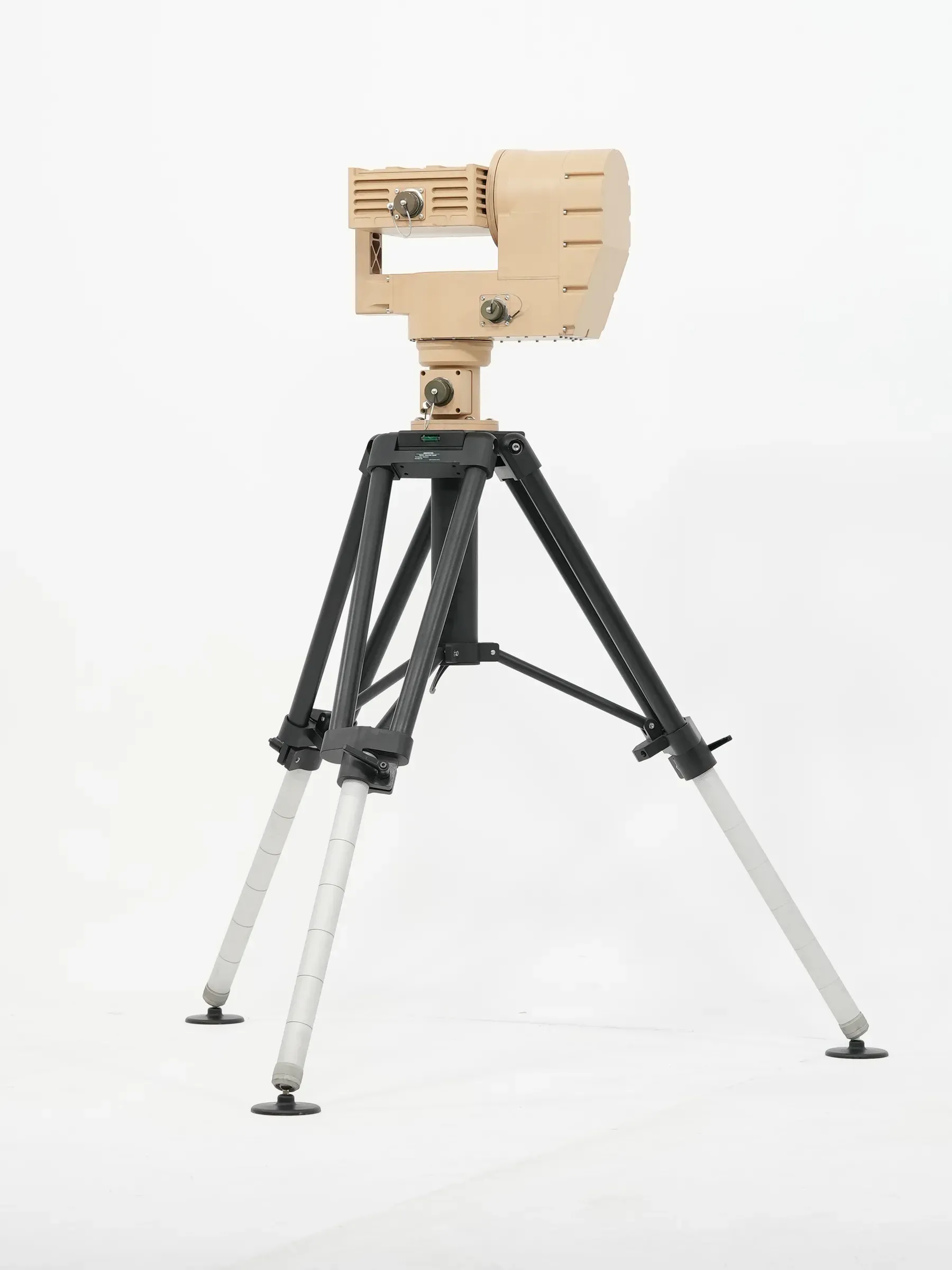 Distant full view of the tan PED12 positioner on an extended black and silver tripod.