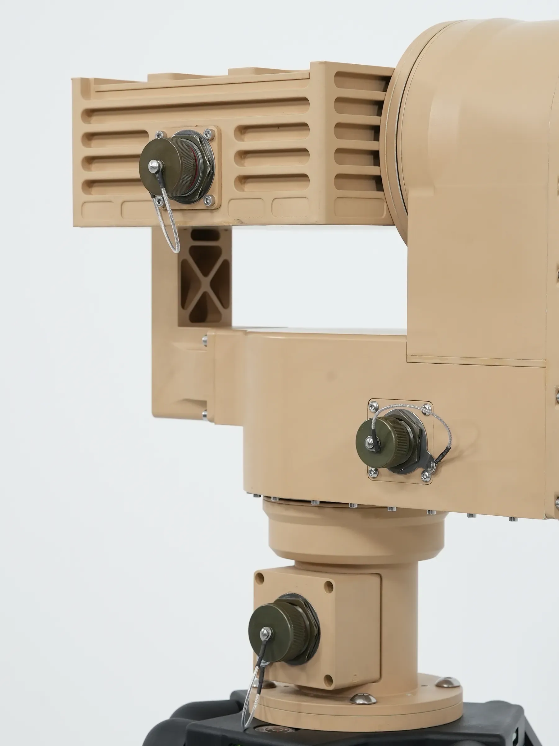 Three-quarter close-up of the tan PED12 head, yoke and azimuth drive with connectors, tripod head below.
