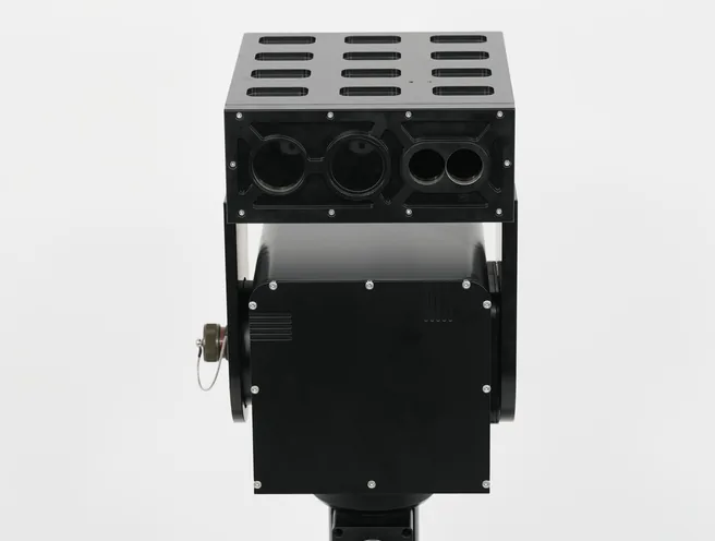 Studio view of the black SEB20 module from above and front, showing the vented top plate and lens apertures.