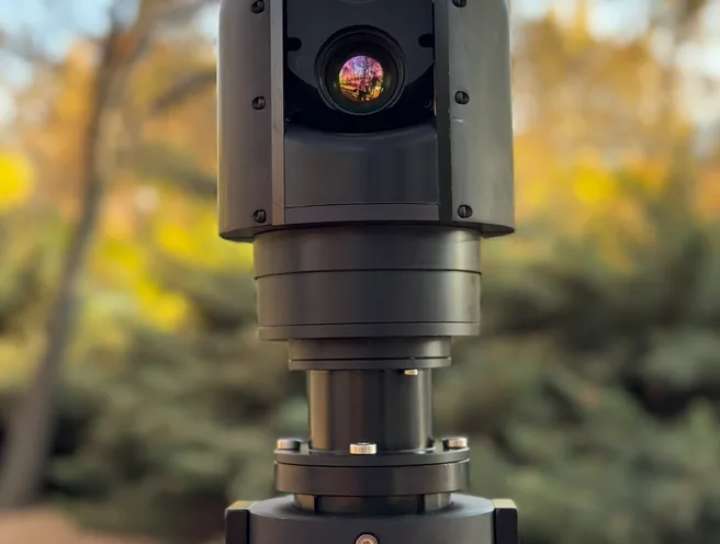 Slightly angled front view of the SEG10 head with both lens apertures visible above its rotator base.