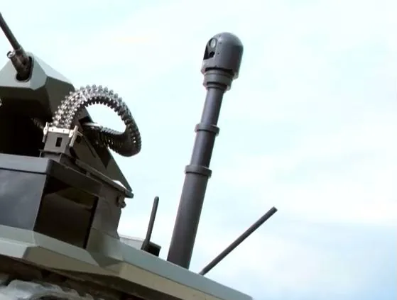 Olive tracked unmanned ground vehicle on a slope with Turkish caption reading thirty percent side incline.