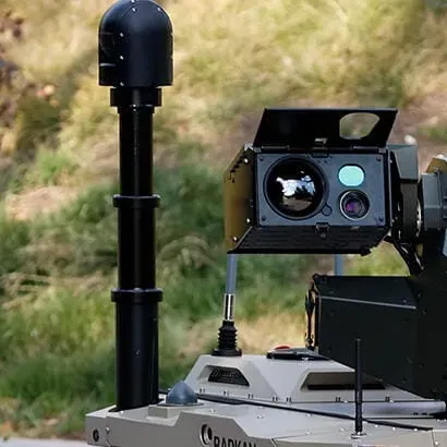The SEG10 head is mounted above a vehicle deck on an extended mast.