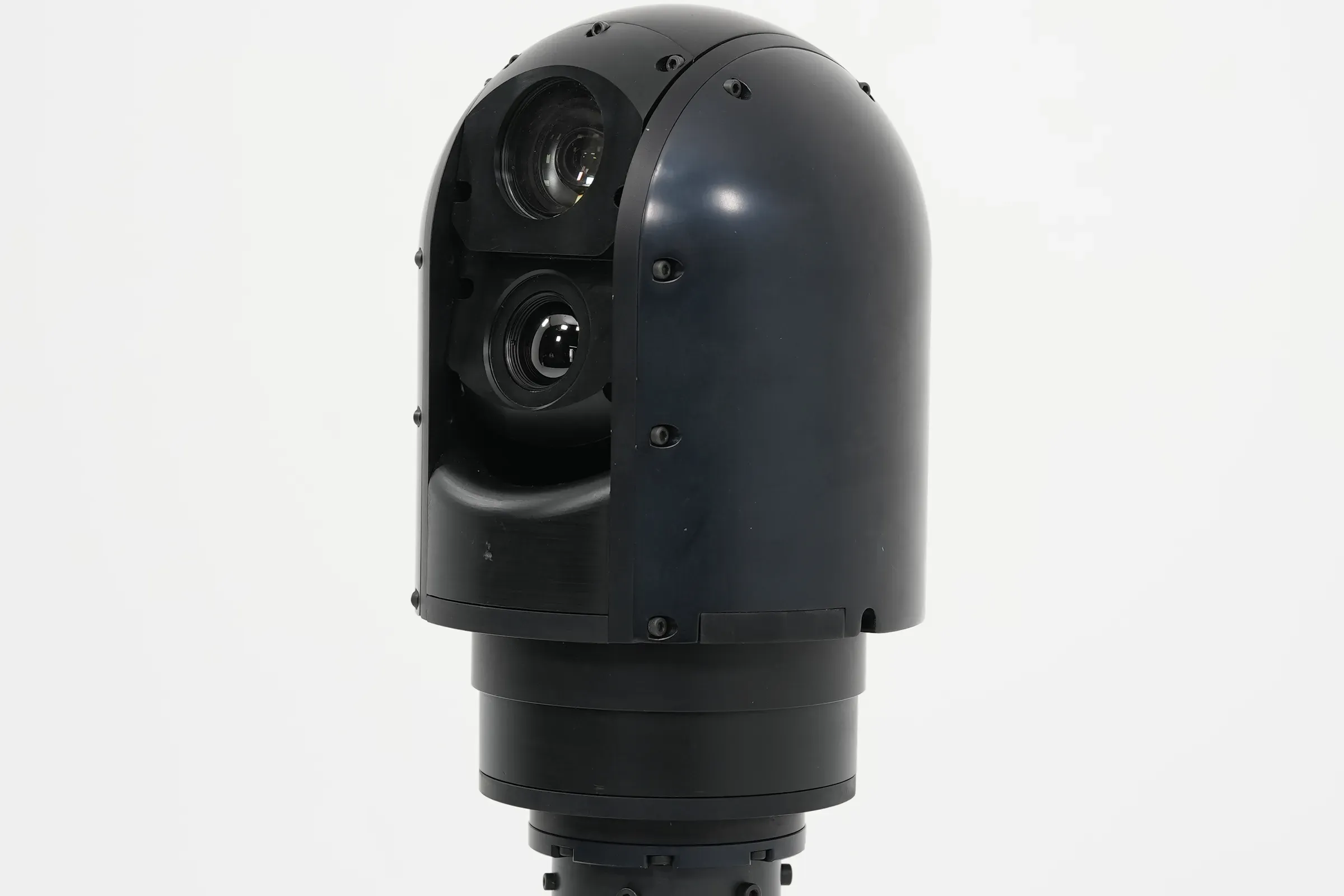 Side view of the SEG10 gimbal head with both apertures visible on its short base.
