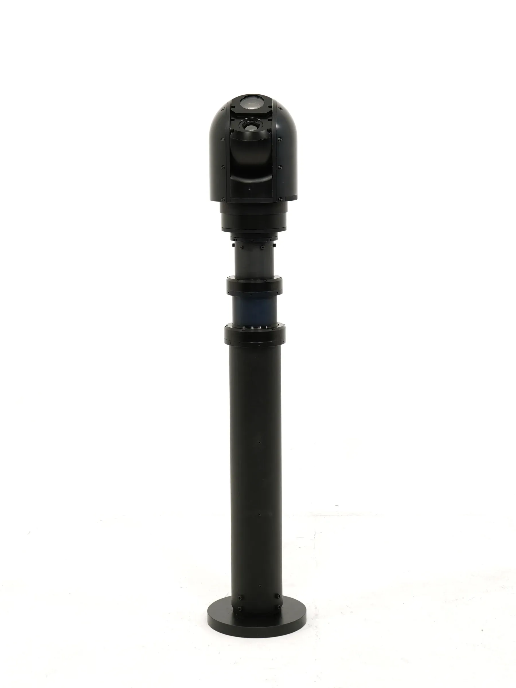 Distant shot of the SEG10 gimbal on a short stowed mast, subject small in frame.