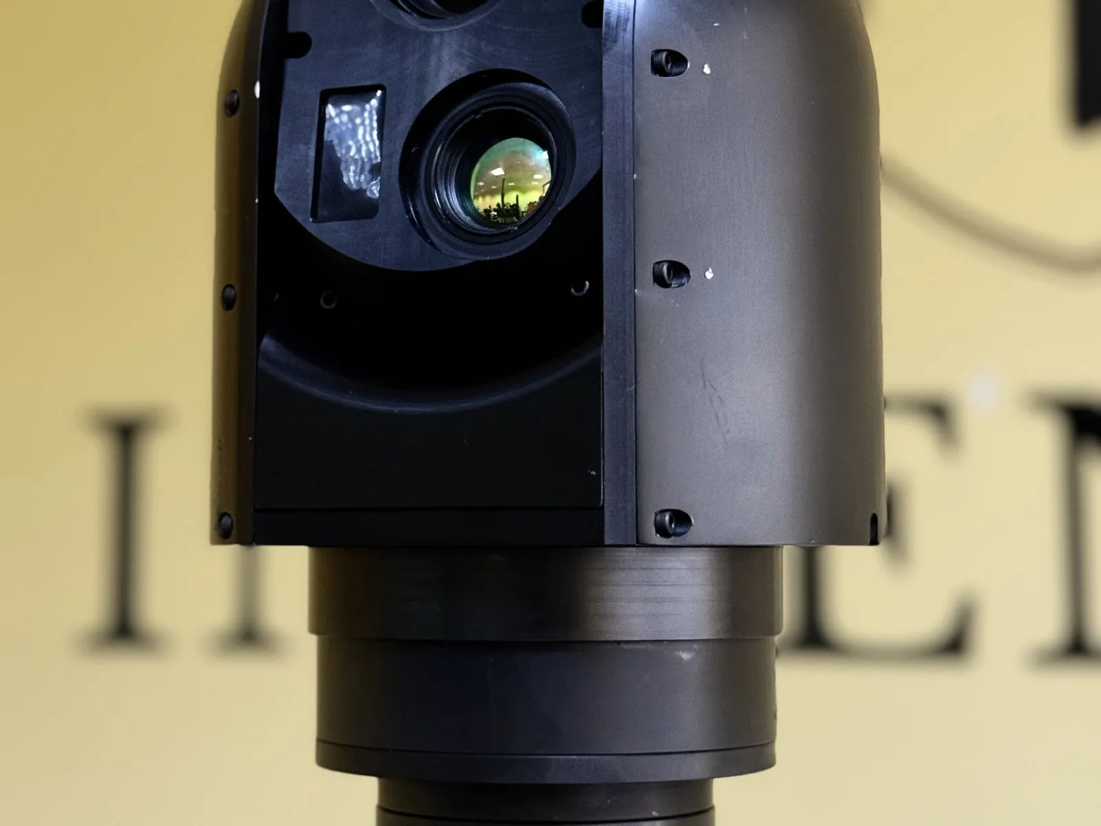Head on, with the EO objective, the rangefinder window and the thermal channel side by side