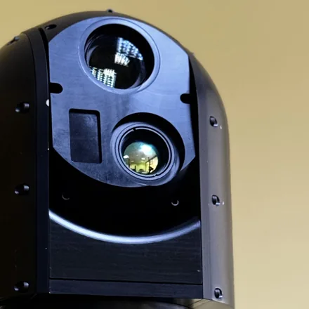 Close crop of the front of the head with the laser and thermal apertures both in the square.