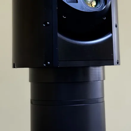 Close crop of the head-to-mast joint with the one cable running out of it.