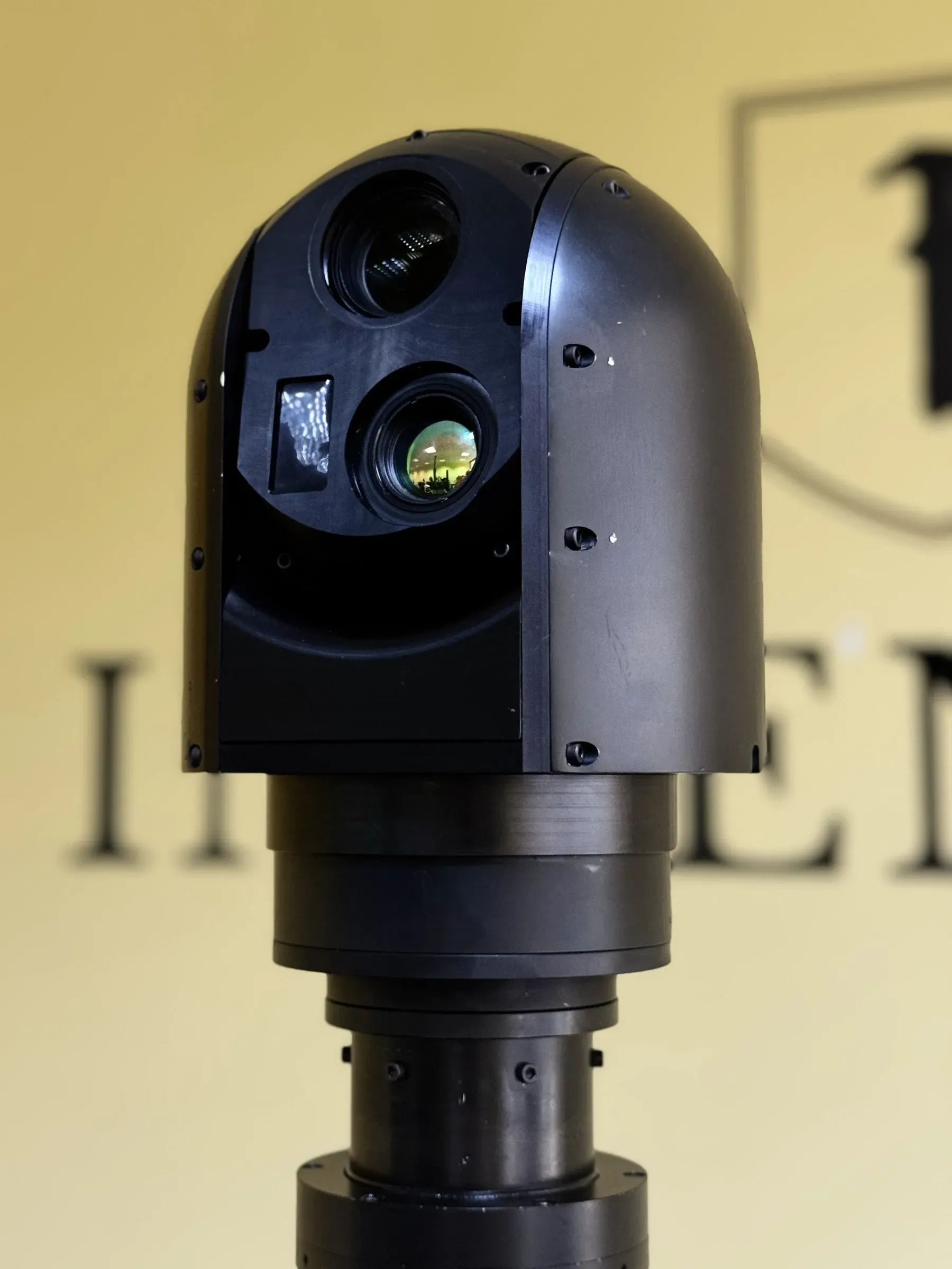 Front close-up of the SEG12 gimbal head showing its two stacked optical windows and rotator.