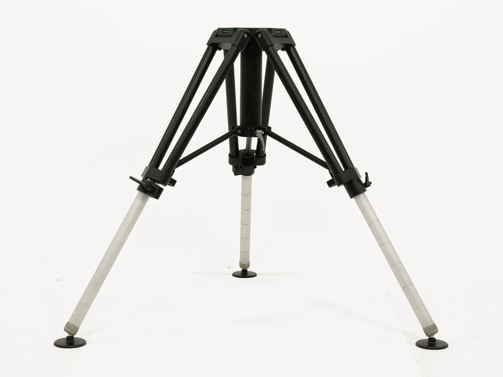 Heavy duty tripod on its own at full height on a plain studio background: hexagonal top plate, brace frame and three legs