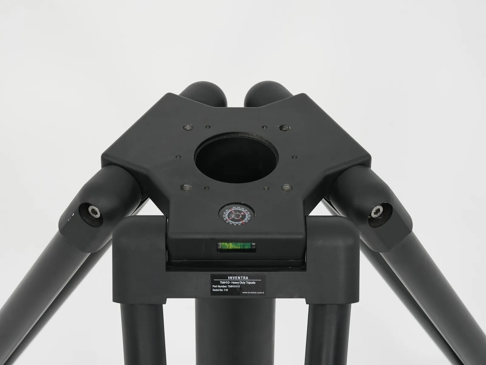 Close view of the top mounting plate and interface: hole pattern and spirit level