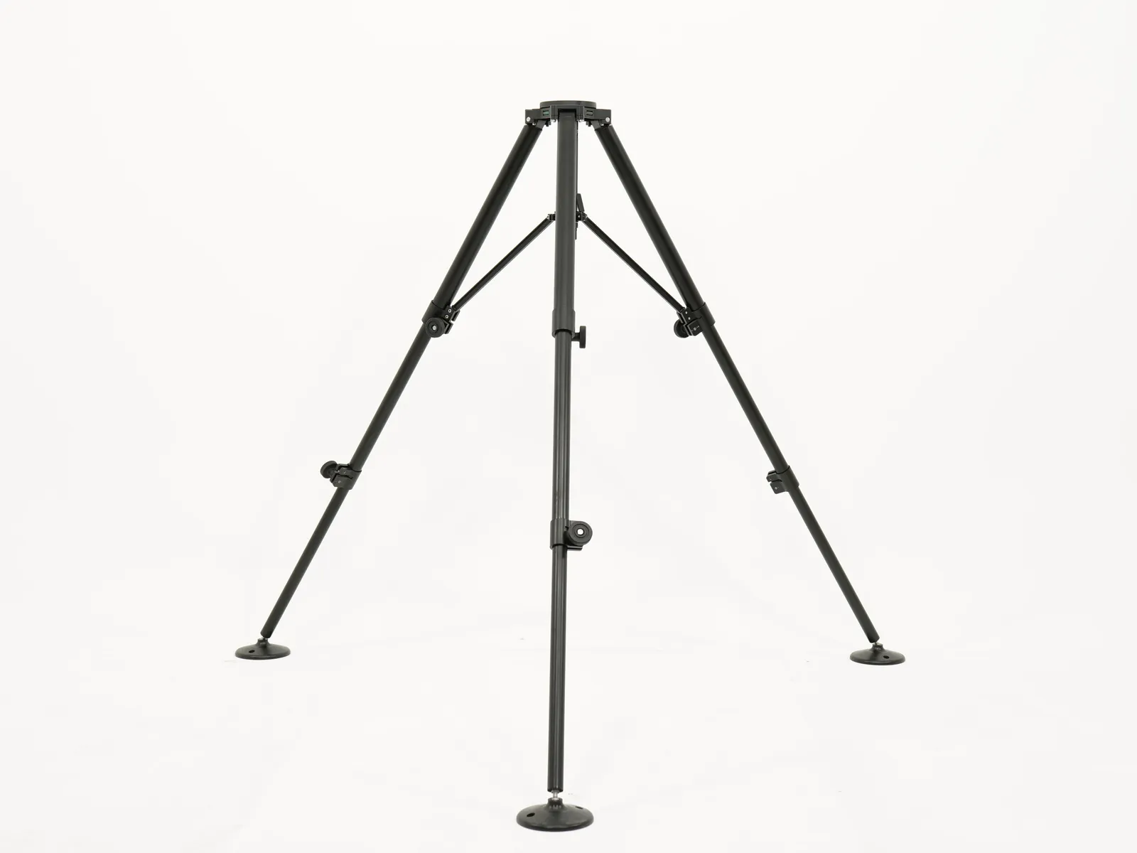 Medium duty tripod on its own with the legs fully spread, on a plain studio background